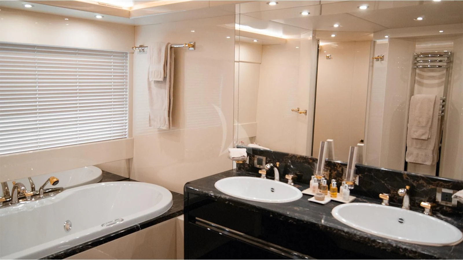 a bathroom with a large mirror aboard MAGIX Yacht for Sale
