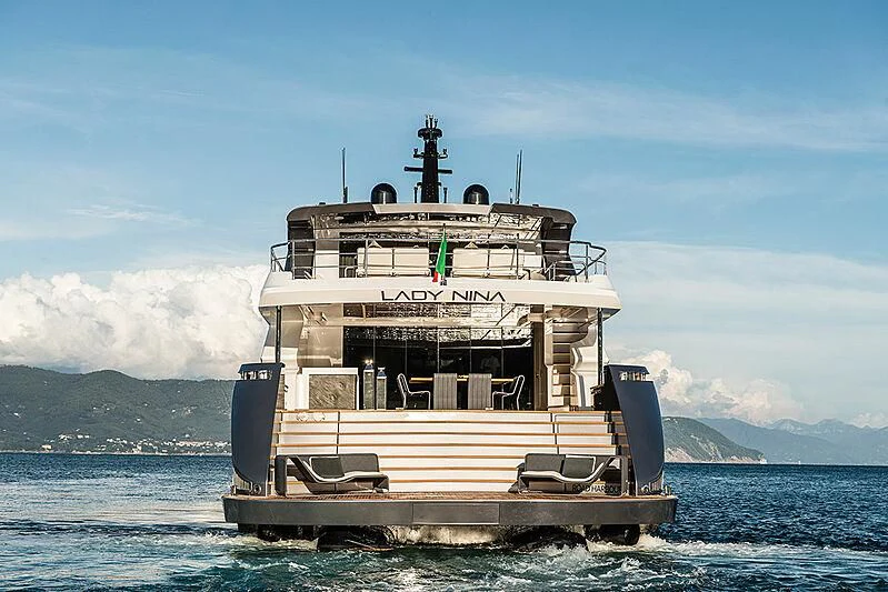 a ship in the water with Thomas Point Shoal Light in the background aboard LADY NINA Yacht for Sale