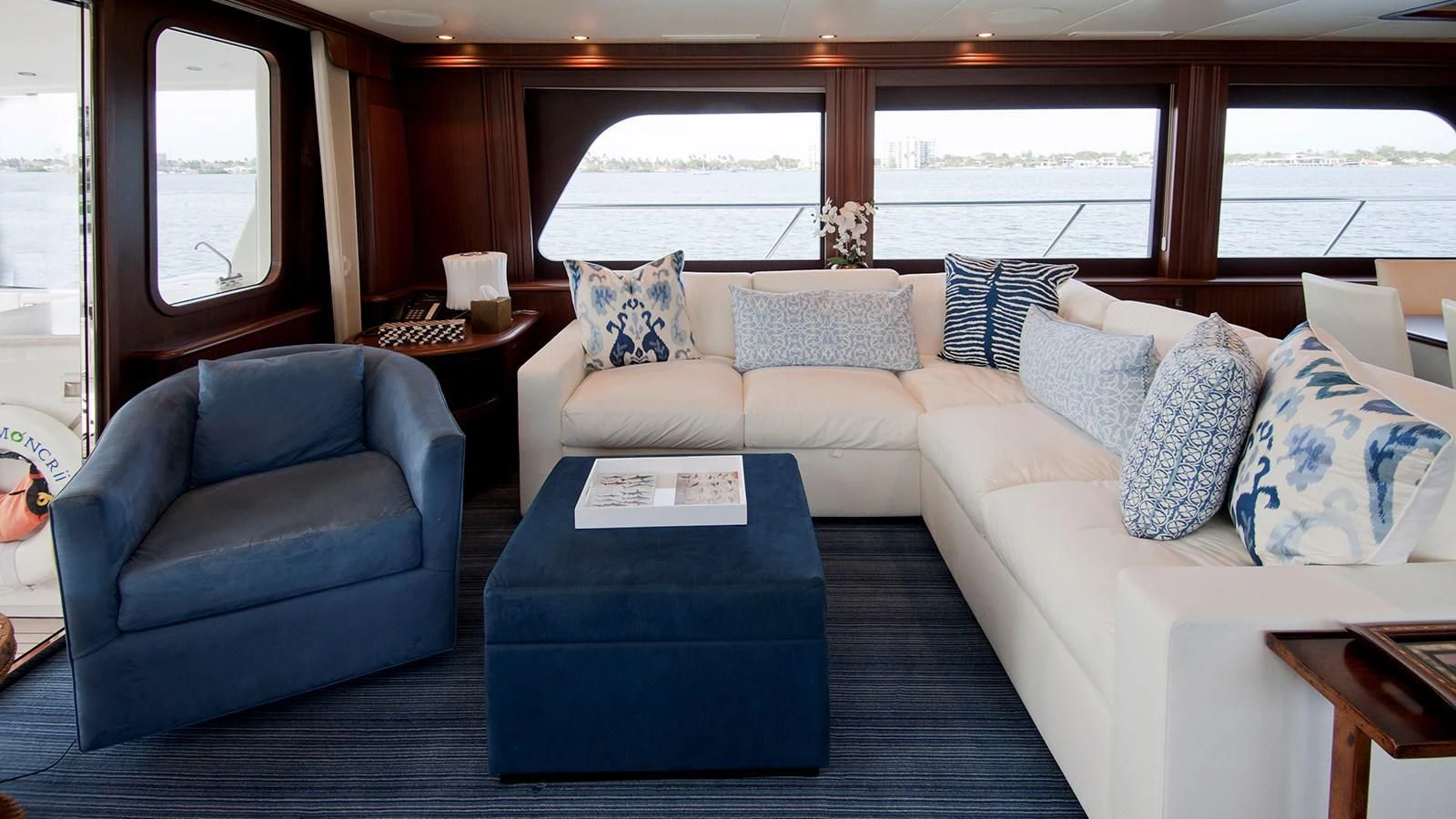 a living room with a couch and a table aboard MONCRII Yacht for Sale