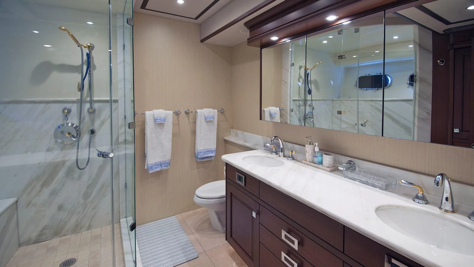 a bathroom with a glass shower aboard MONCRII Yacht for Sale