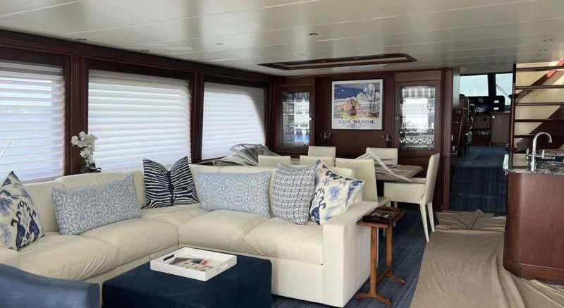 a living room with a couch and a table aboard MONCRII Yacht for Sale