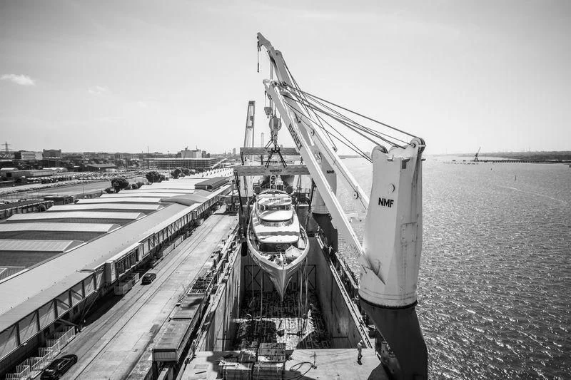 a large crane over a body of water aboard EXCELLENCE V Yacht for Sale