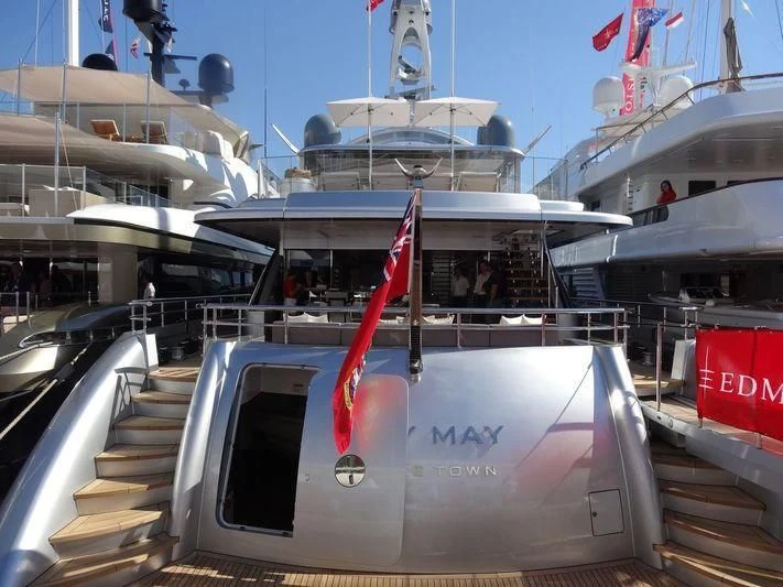 a boat with a red ribbon on the front aboard EXCELLENCE V Yacht for Sale
