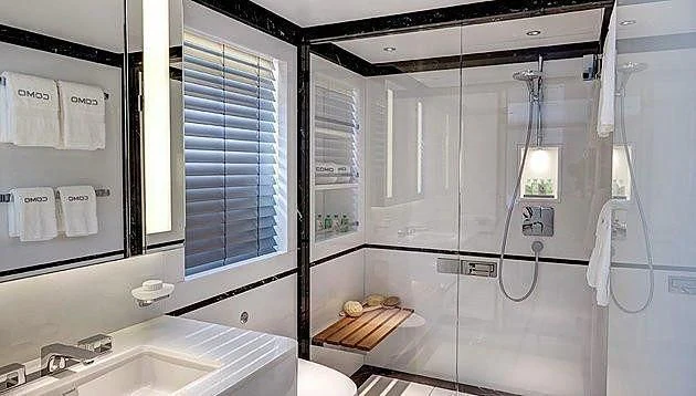 a bathroom with a shower unit aboard EXCELLENCE V Yacht for Sale