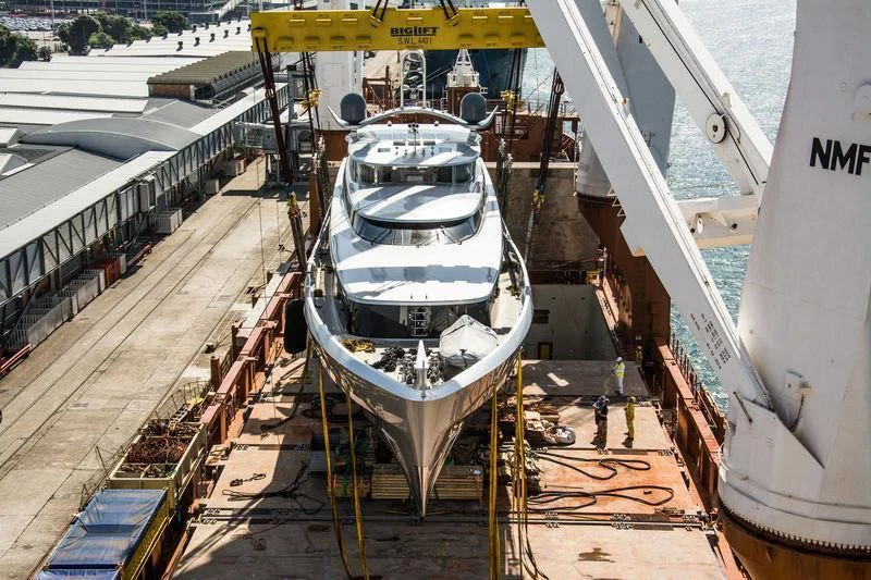 a boat being loaded with cargo aboard EXCELLENCE V Yacht for Sale