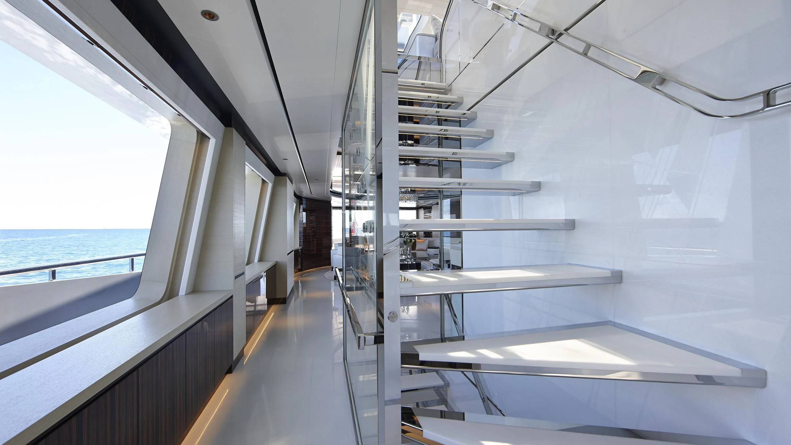 a room with a glass wall and a ladder and a window aboard EXCELLENCE V Yacht for Sale