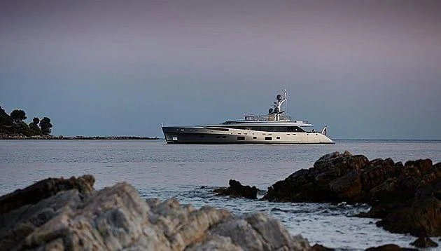 a white boat on the water aboard EXCELLENCE V Yacht for Sale