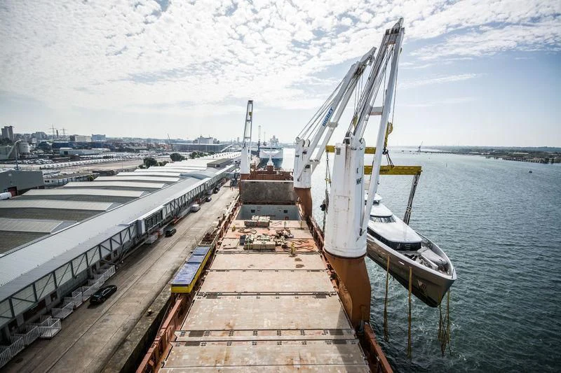 a bridge over water with a boat on it aboard EXCELLENCE V Yacht for Sale