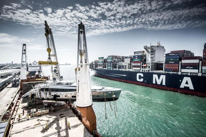 a large ship docked at a port aboard EXCELLENCE V Yacht for Sale