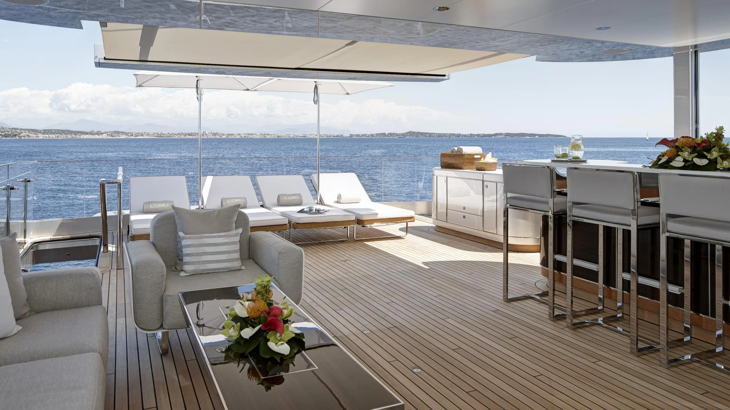 a room with a table chairs and a large body of water aboard EXCELLENCE V Yacht for Sale