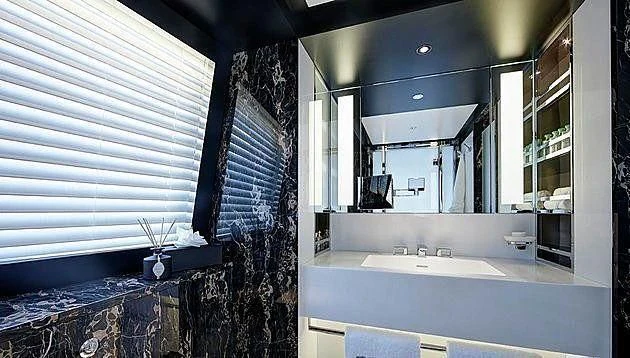 a kitchen with a sink and cabinets aboard EXCELLENCE V Yacht for Sale