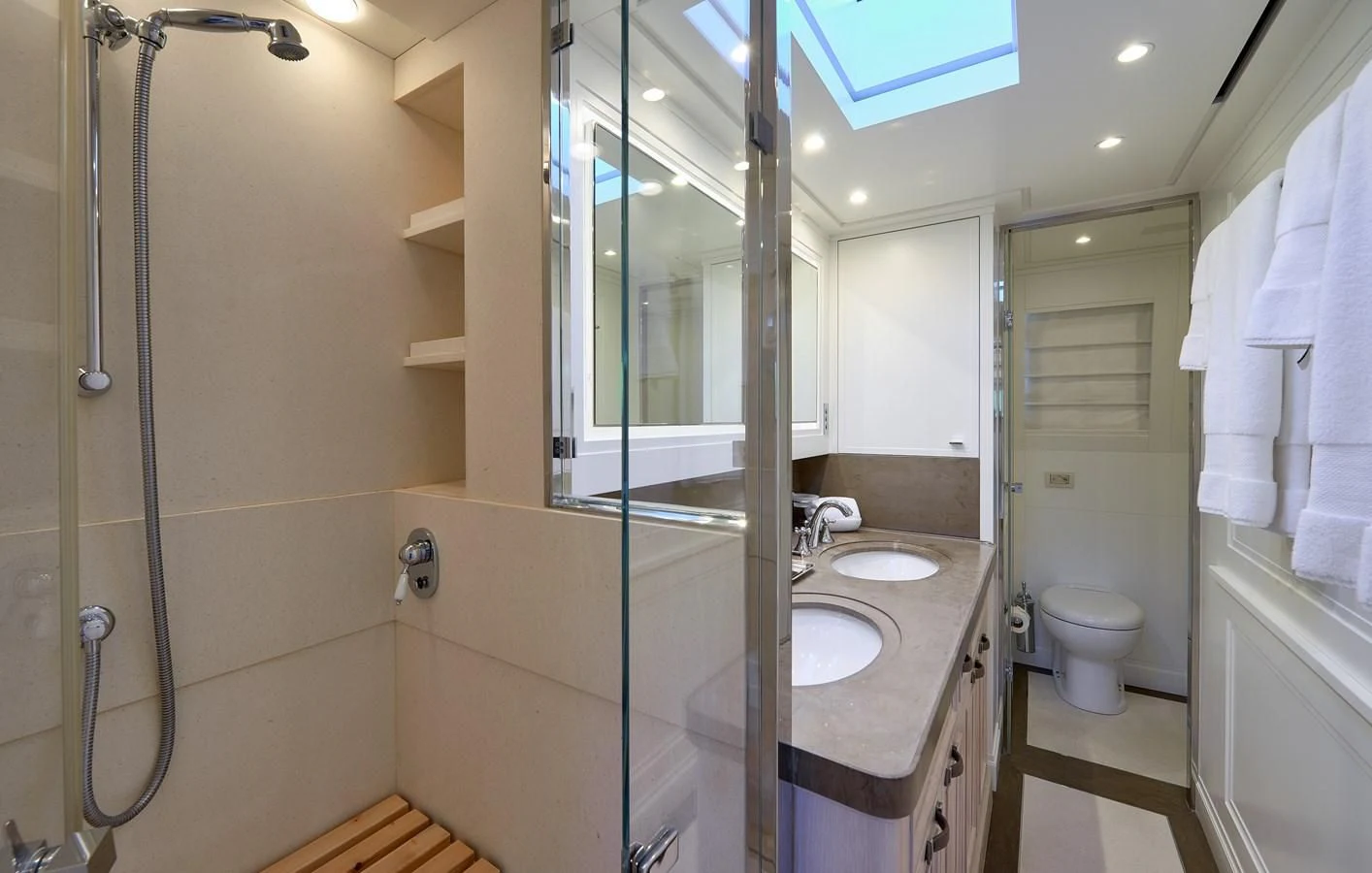 a bathroom with a glass shower aboard 2011 SANLORENZO SD92 FLYBRIDGE Yacht for Sale