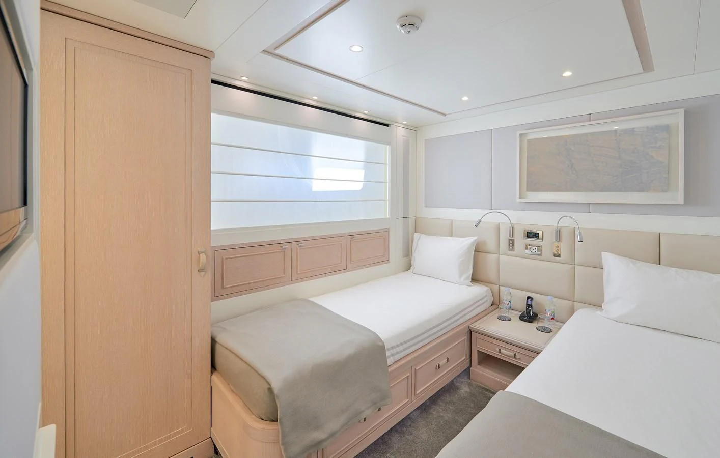 a room with two beds aboard 2011 SANLORENZO SD92 FLYBRIDGE Yacht for Sale