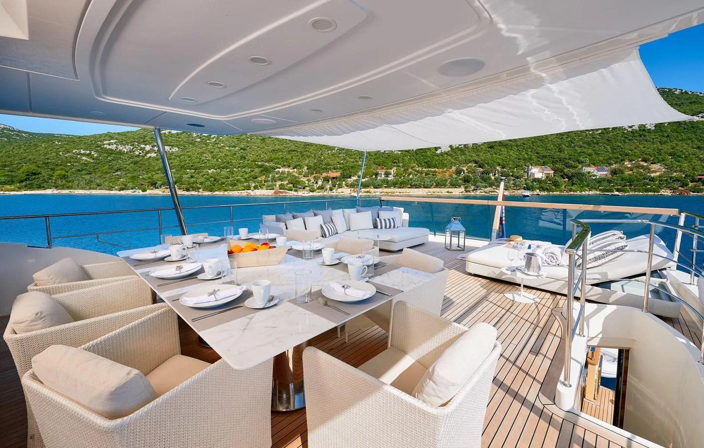 a room with tables and chairs aboard 2011 SANLORENZO SD92 FLYBRIDGE Yacht for Sale