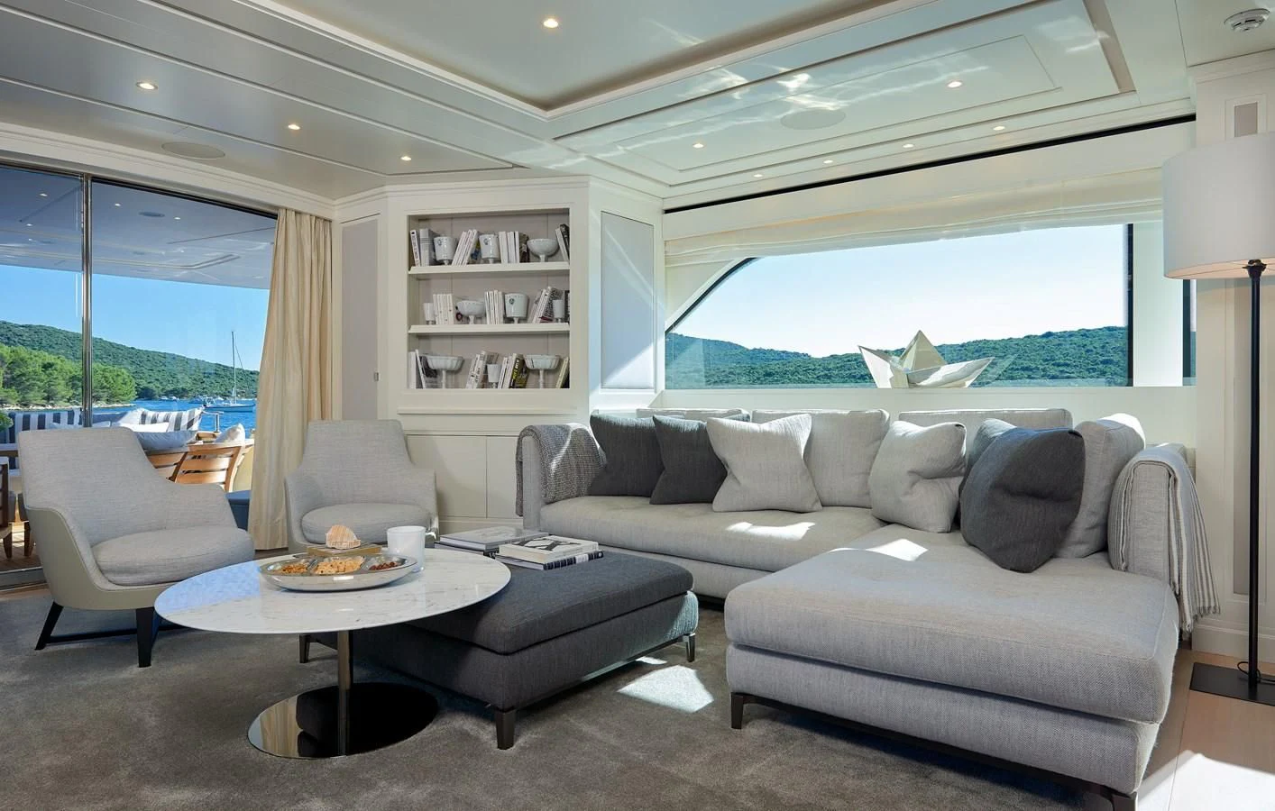 a living room with a couch and a table aboard 2011 SANLORENZO SD92 FLYBRIDGE Yacht for Sale