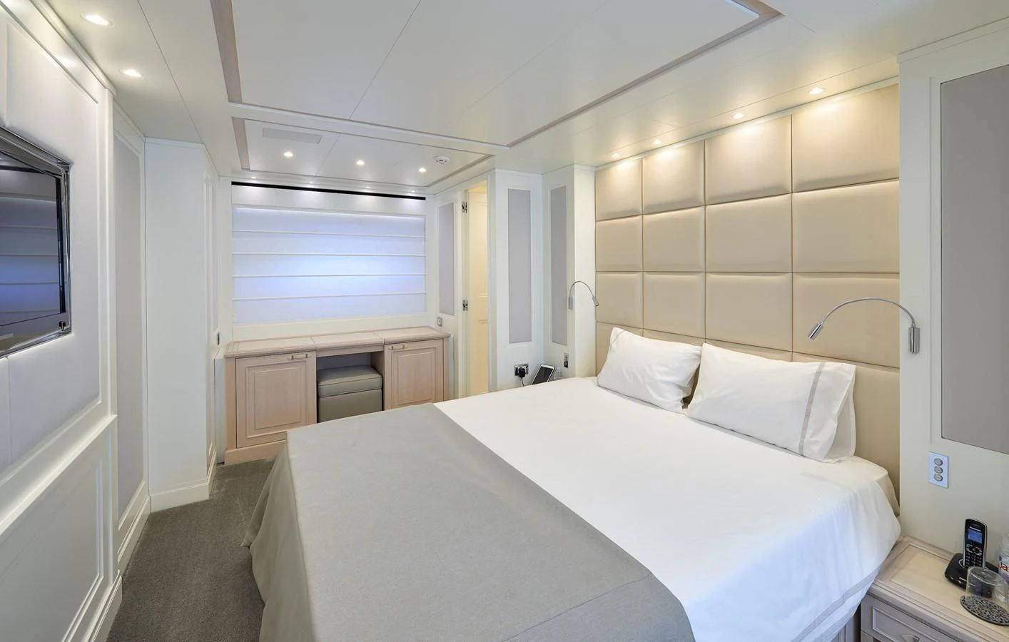 a bedroom with a bed and a desk aboard 2011 SANLORENZO SD92 FLYBRIDGE Yacht for Sale