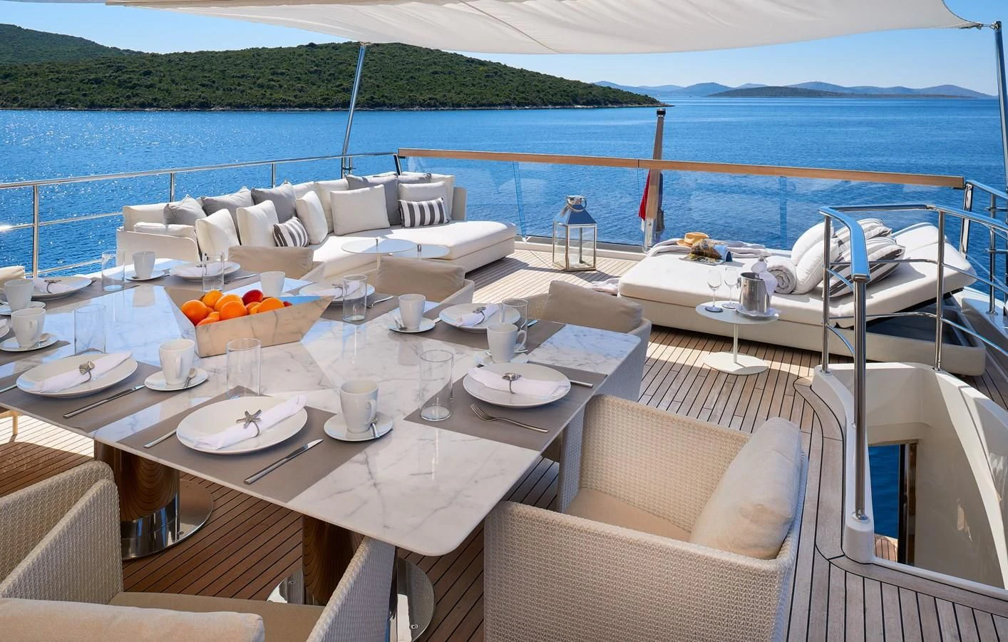 a table set for a meal on a boat aboard 2011 SANLORENZO SD92 FLYBRIDGE Yacht for Sale