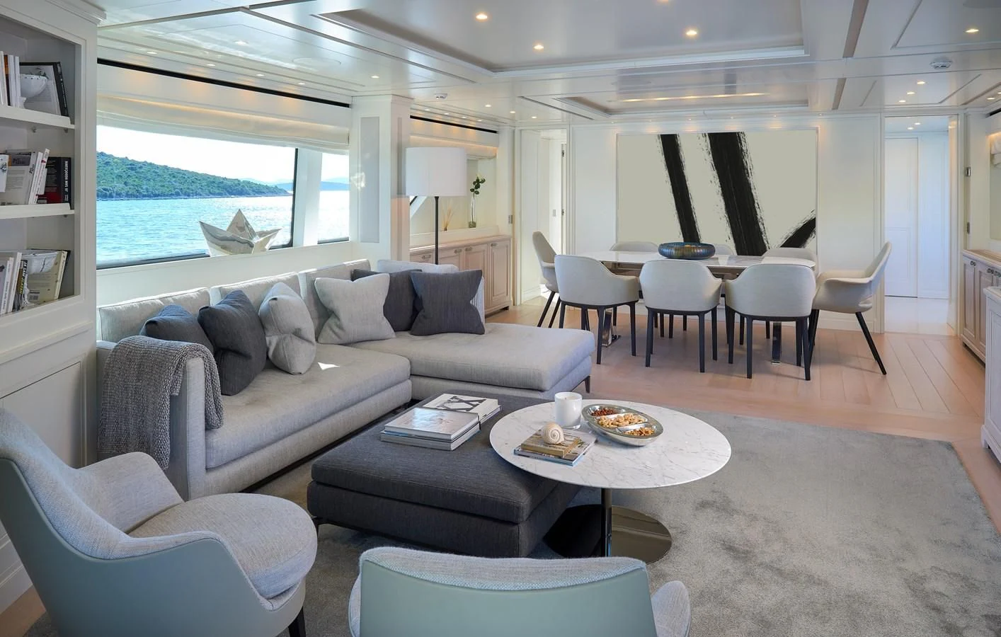 a living room with a couch and a table aboard 2011 SANLORENZO SD92 FLYBRIDGE Yacht for Sale