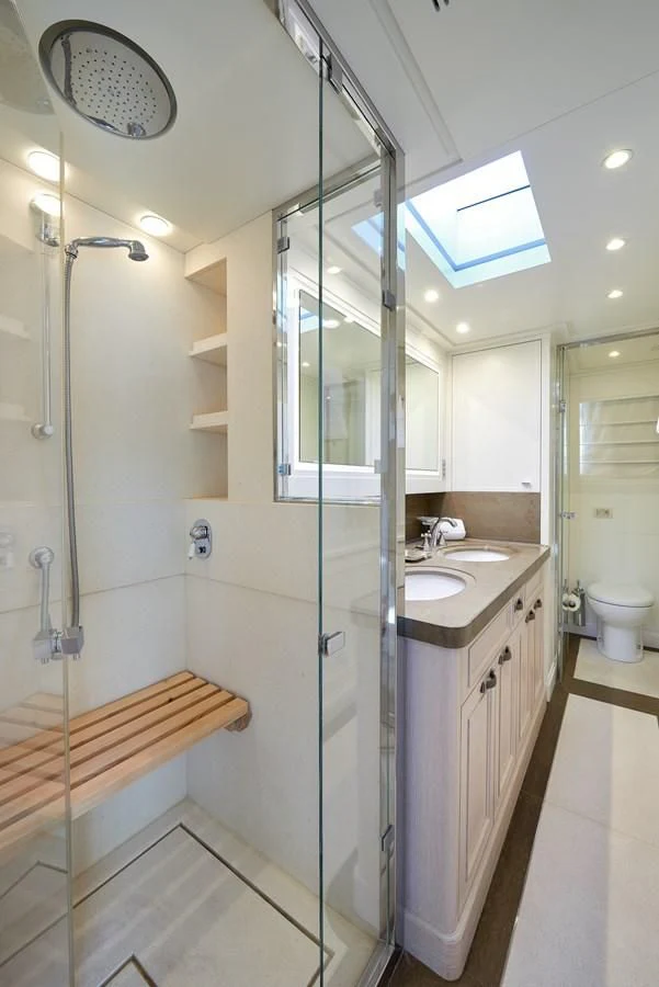 a bathroom with a glass shower aboard 2011 SANLORENZO SD92 FLYBRIDGE Yacht for Sale
