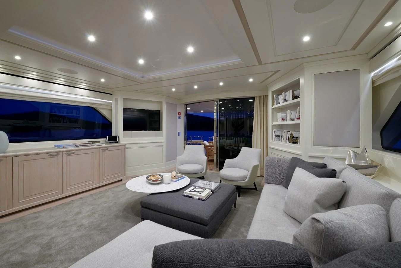 a living room with a large screen aboard 2011 SANLORENZO SD92 FLYBRIDGE Yacht for Sale