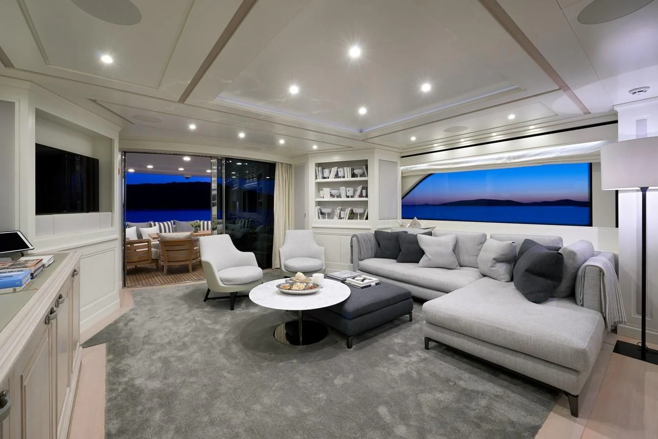a living room with a large screen aboard 2011 SANLORENZO SD92 FLYBRIDGE Yacht for Sale