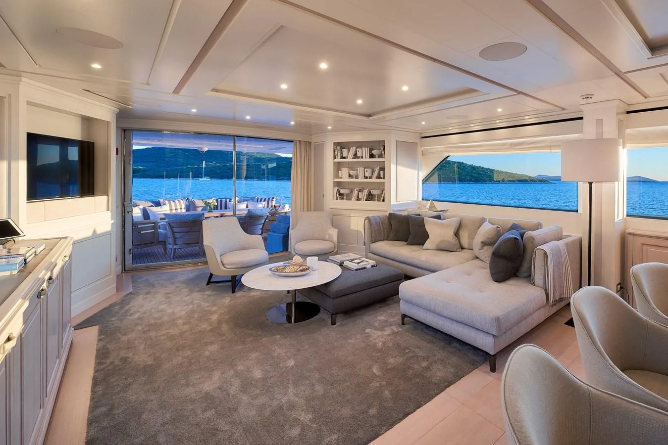a living room with a large window aboard 2011 SANLORENZO SD92 FLYBRIDGE Yacht for Sale