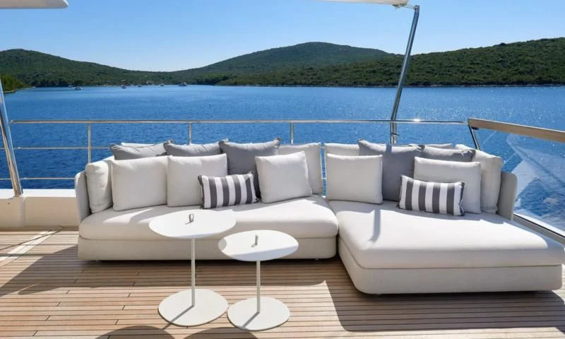 a white couch on a boat aboard 2011 SANLORENZO SD92 FLYBRIDGE Yacht for Sale
