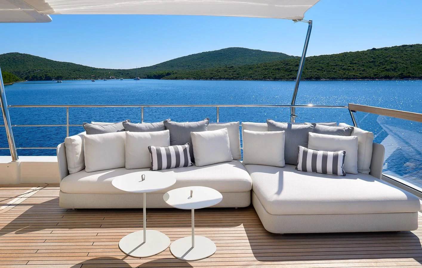 a white couch on a boat aboard 2011 SANLORENZO SD92 FLYBRIDGE Yacht for Sale