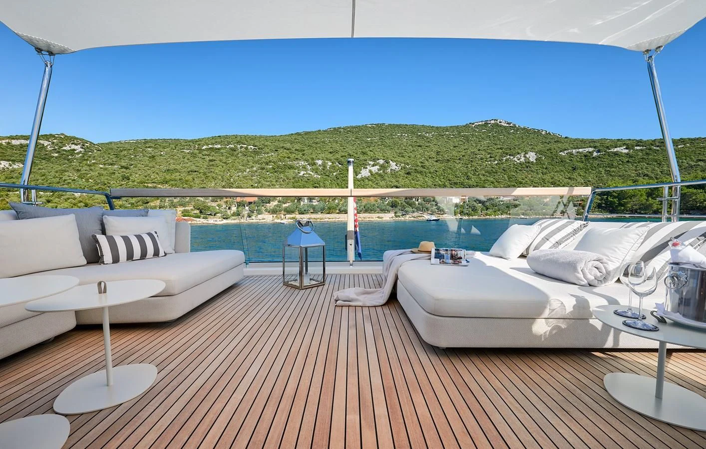 a deck with a couple of beds on it aboard 2011 SANLORENZO SD92 FLYBRIDGE Yacht for Sale