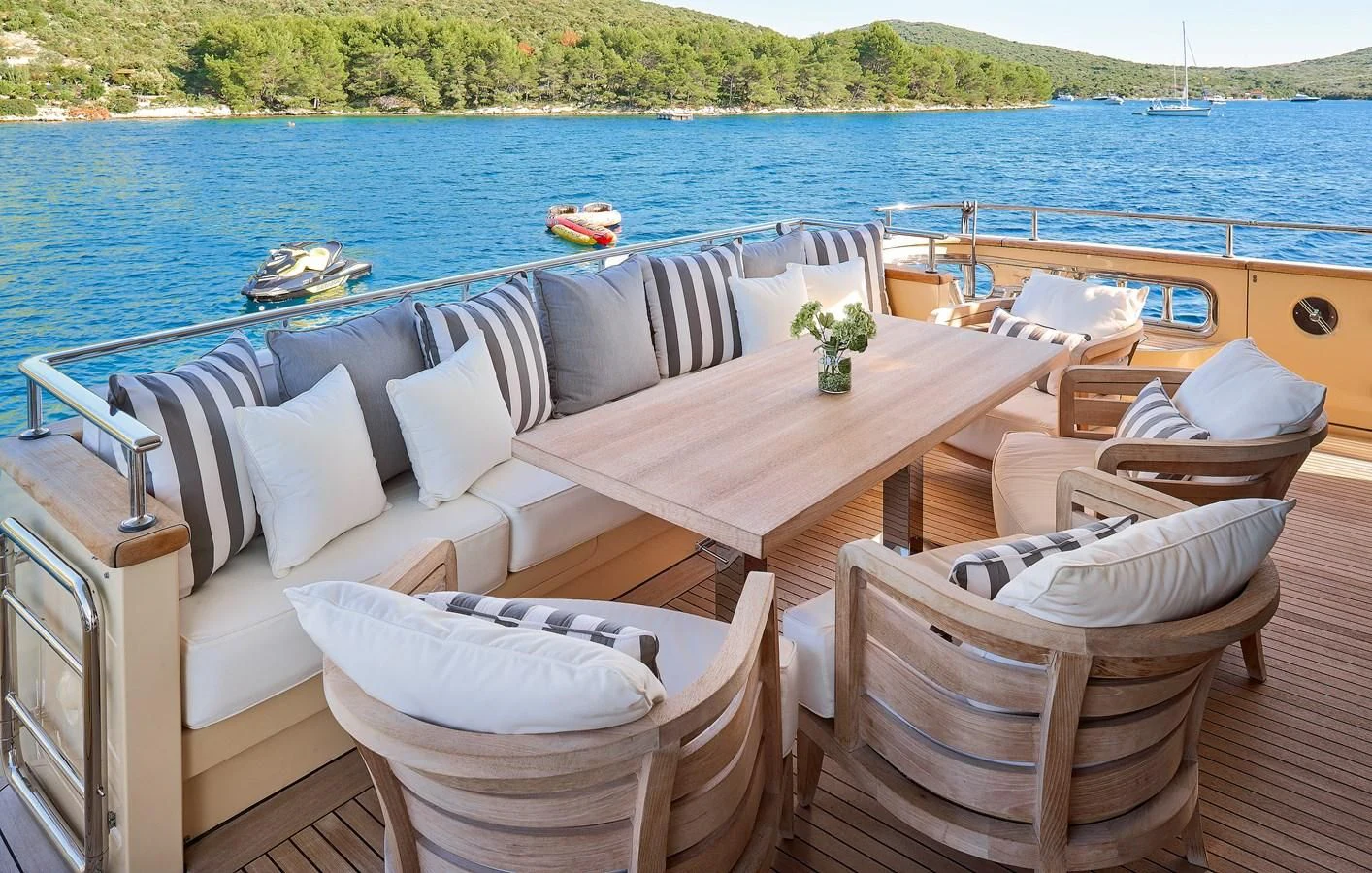 a table and chairs on a boat aboard 2011 SANLORENZO SD92 FLYBRIDGE Yacht for Sale