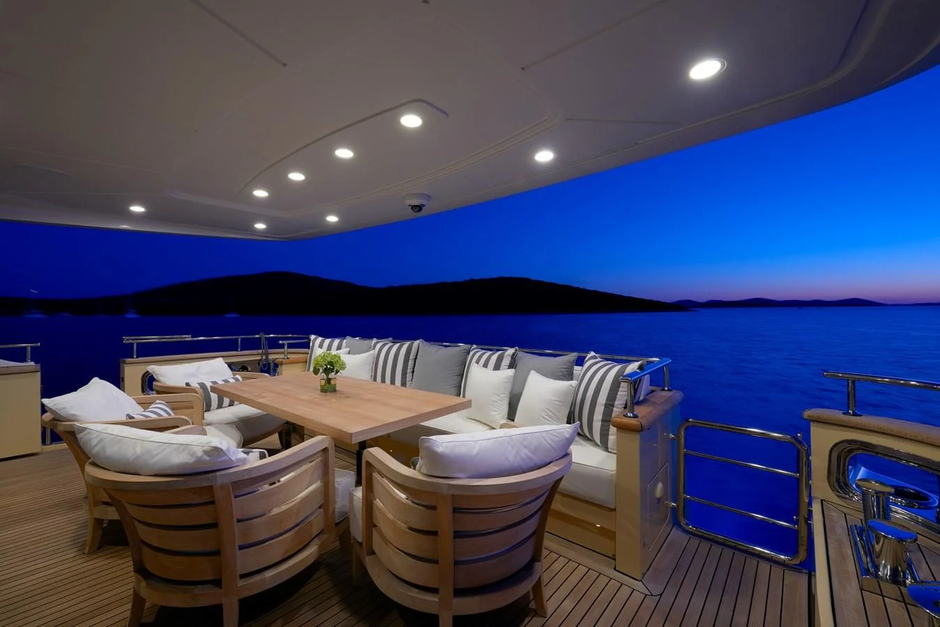 a pool with tables and chairs aboard 2011 SANLORENZO SD92 FLYBRIDGE Yacht for Sale