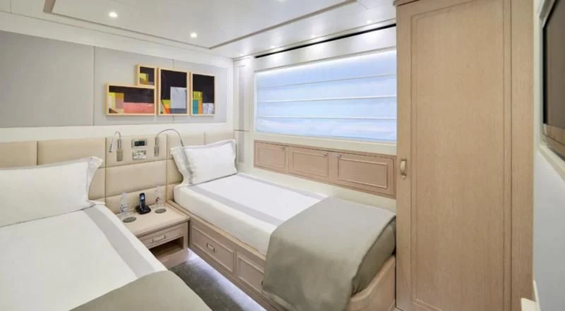 a room with two beds aboard 2011 SANLORENZO SD92 FLYBRIDGE Yacht for Sale