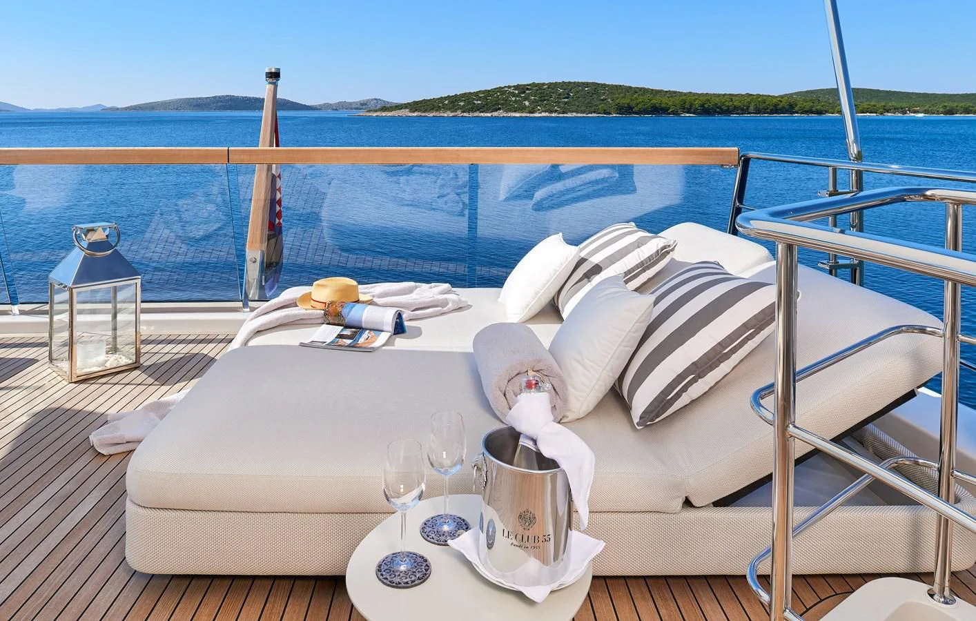 a white bed on a deck aboard 2011 SANLORENZO SD92 FLYBRIDGE Yacht for Sale