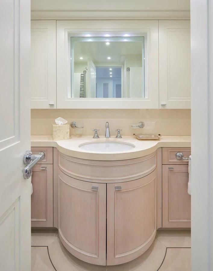 a bathroom with a sink and a mirror aboard 2011 SANLORENZO SD92 FLYBRIDGE Yacht for Sale