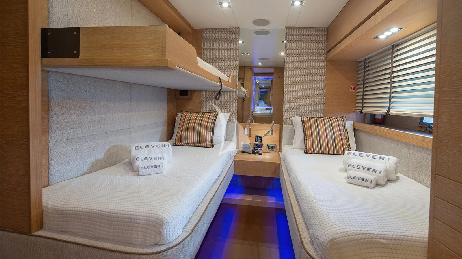 a room with two beds aboard ELEVEN I Yacht for Sale