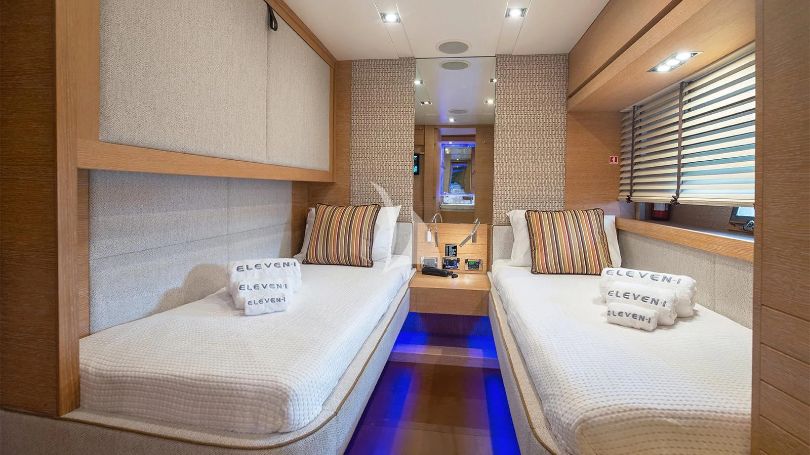 a room with two beds aboard ELEVEN I Yacht for Sale