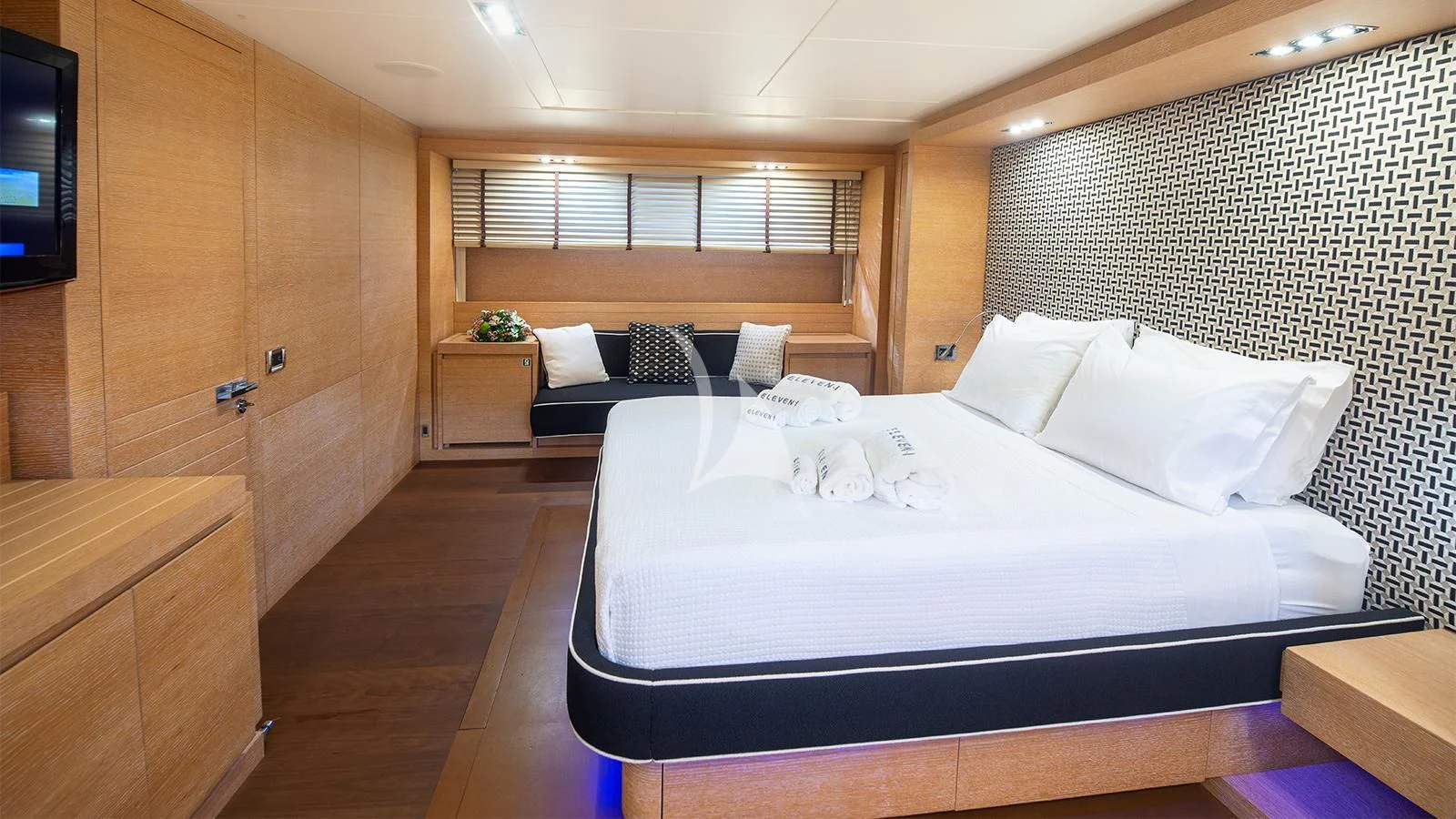 a room with a bed and a tv aboard ELEVEN I Yacht for Sale