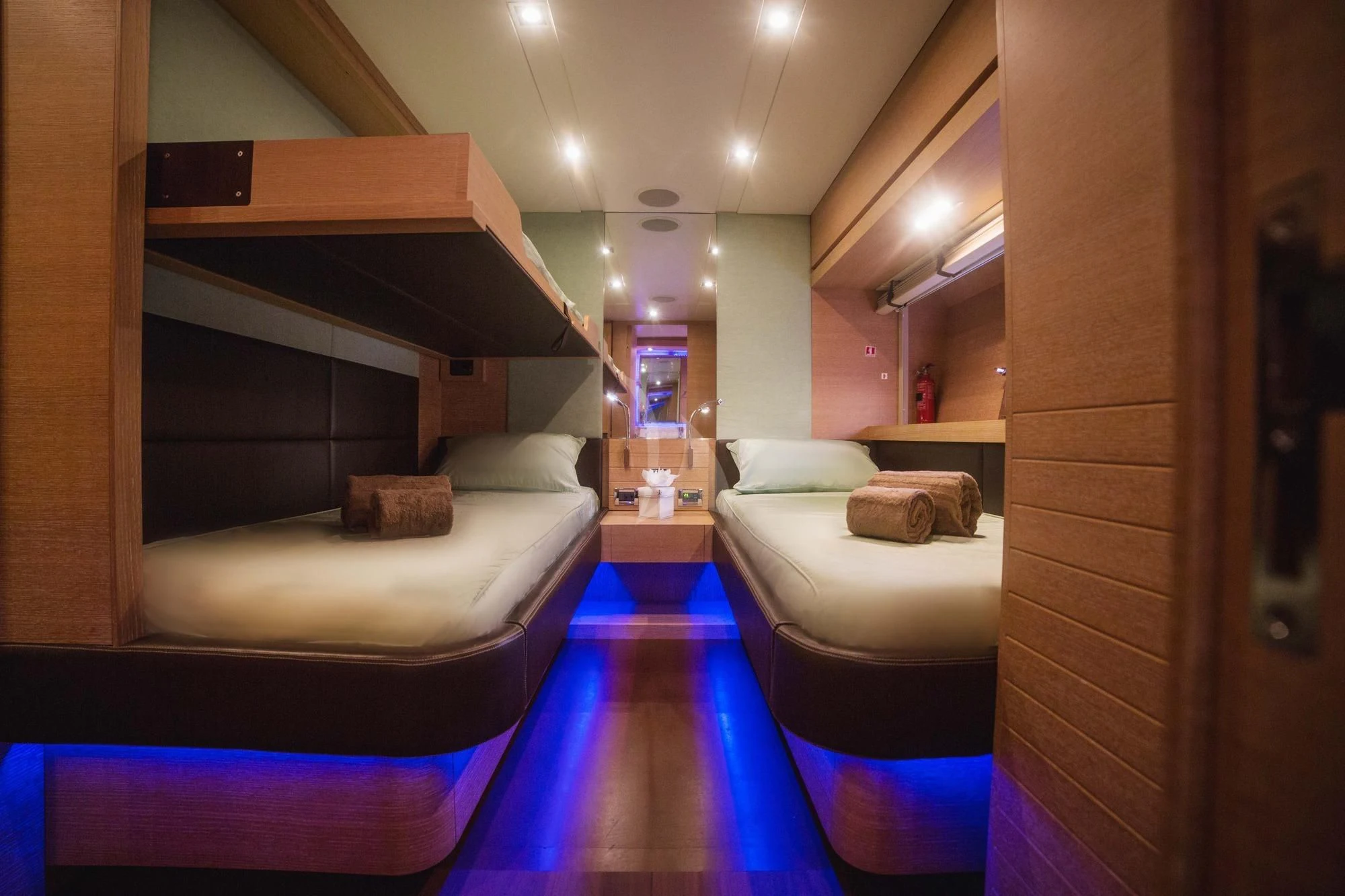 a room with a bed and a desk aboard ELEVEN I Yacht for Sale