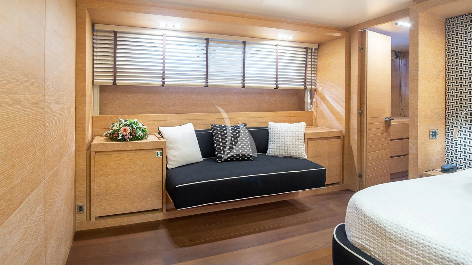 a bed and a desk in a room aboard ELEVEN I Yacht for Sale