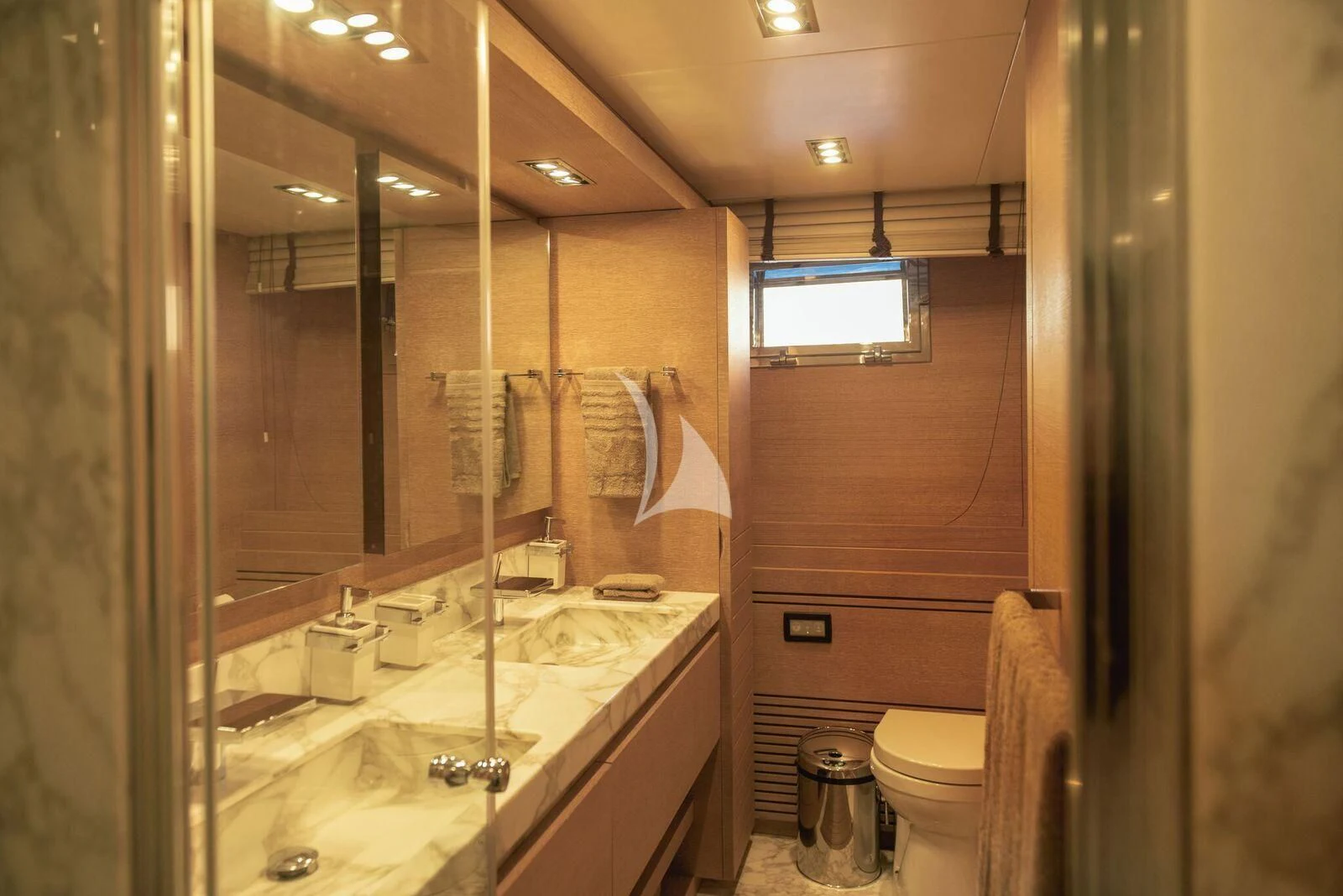 a bathroom with a large mirror aboard ELEVEN I Yacht for Sale