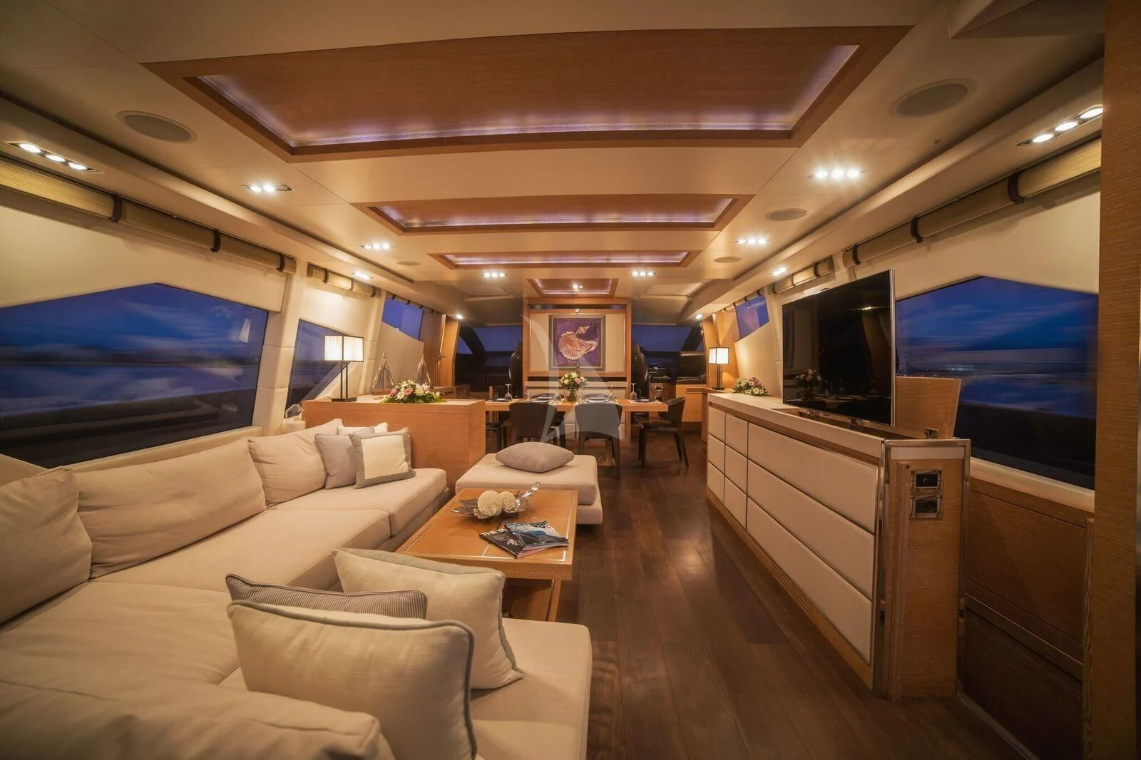 a living room with a large screen aboard ELEVEN I Yacht for Sale