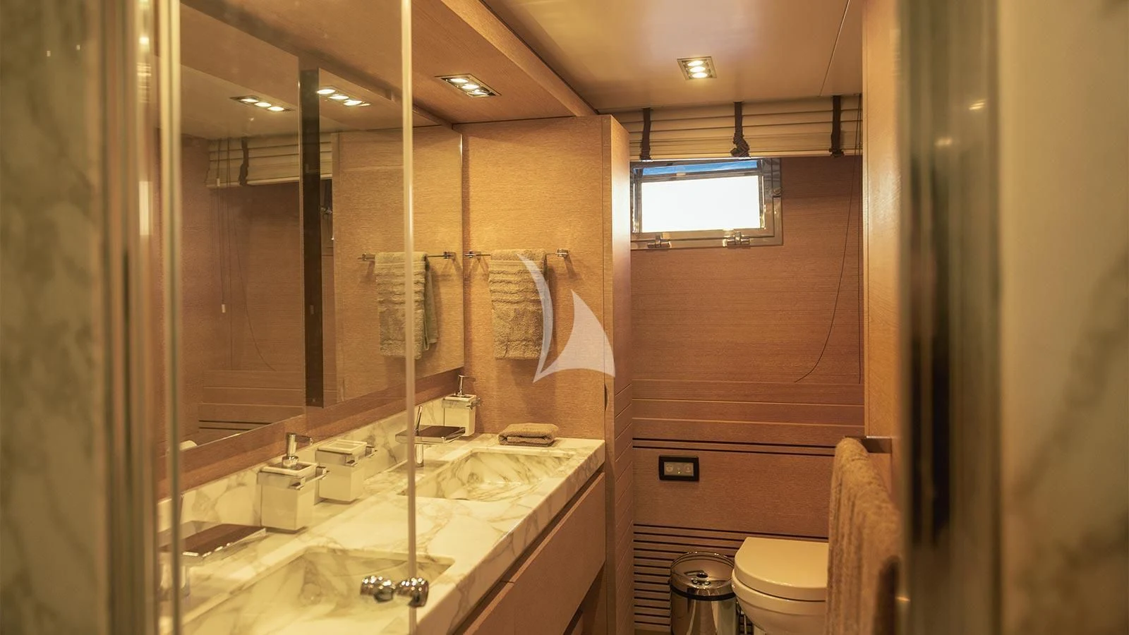 a bathroom with a large mirror aboard ELEVEN I Yacht for Sale