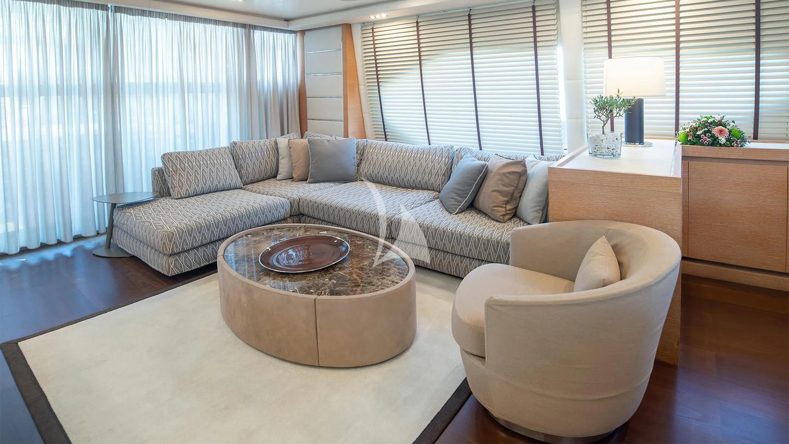 a living room with a couch and a coffee table aboard ELEVEN I Yacht for Sale