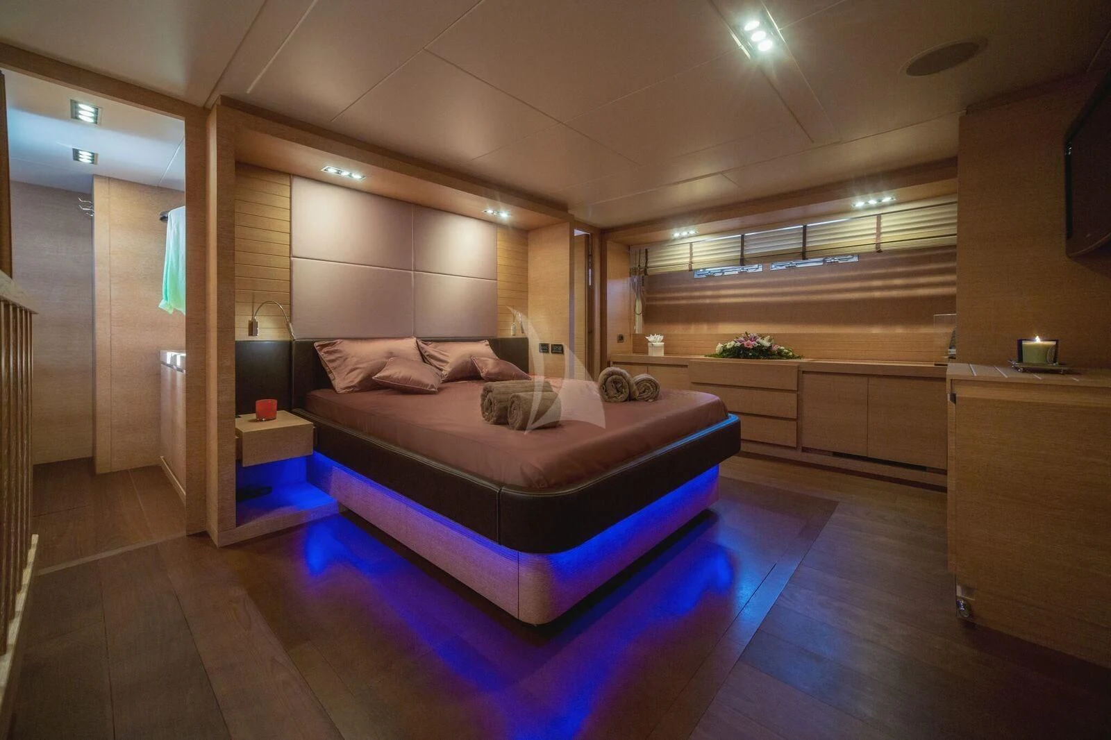 a bedroom with a large bed aboard ELEVEN I Yacht for Sale