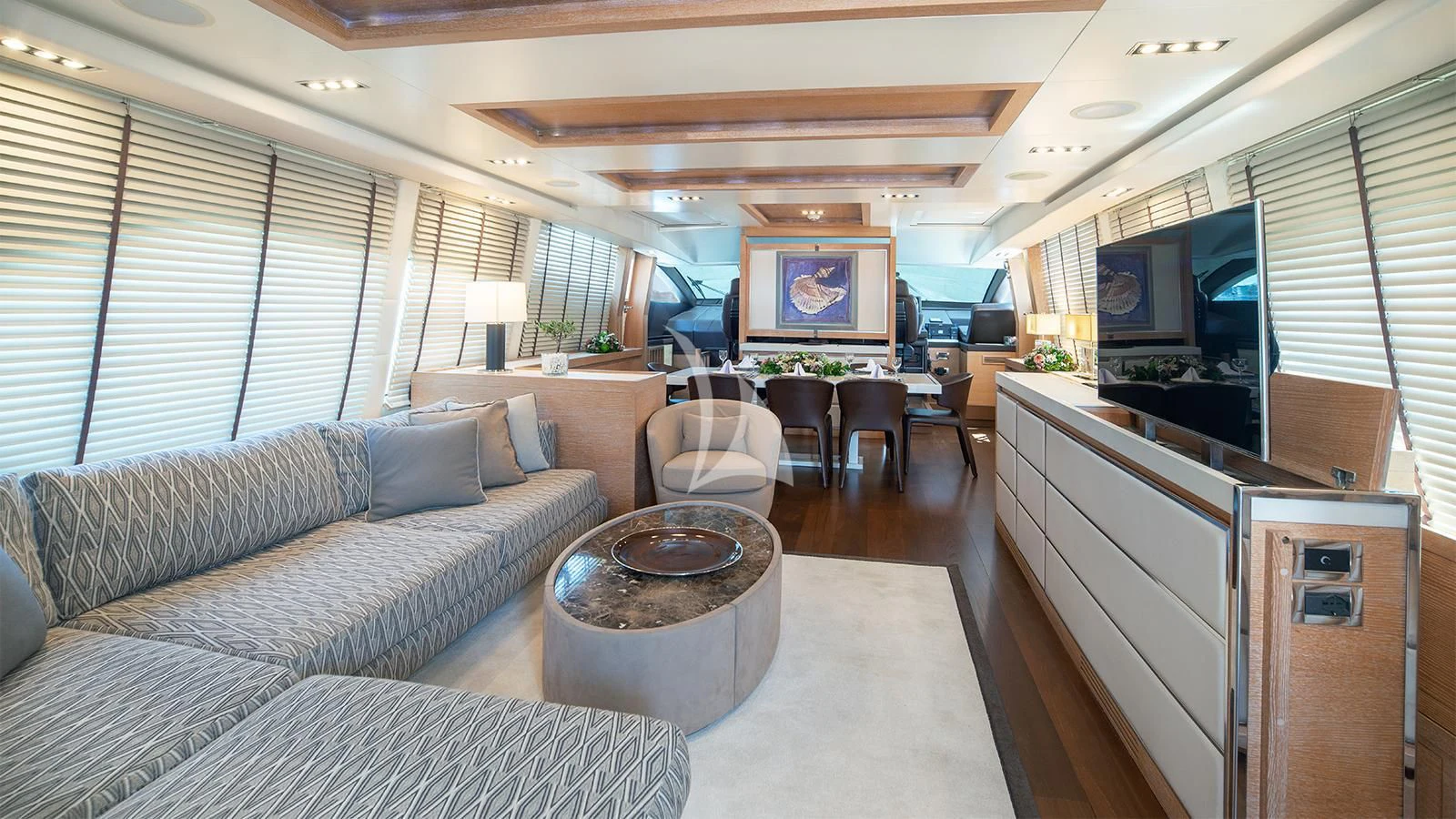 a living room with a couch and a coffee table aboard ELEVEN I Yacht for Sale