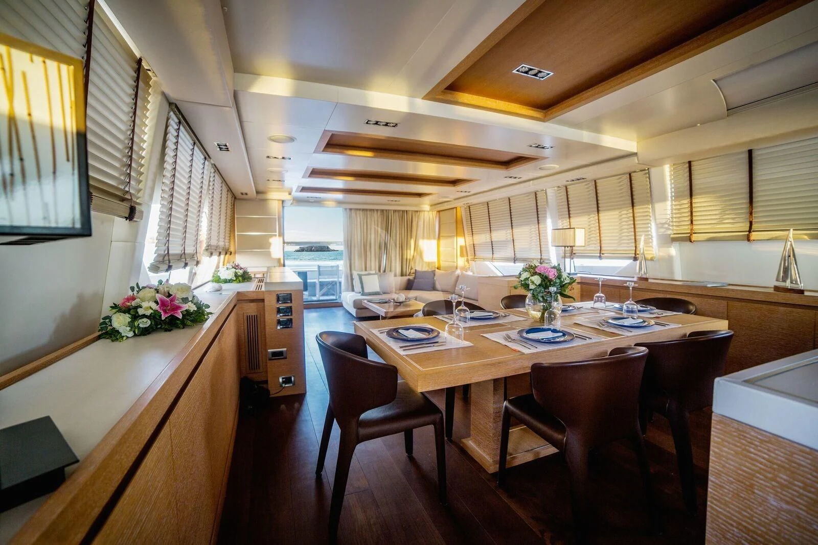 a large kitchen with a table and chairs aboard ELEVEN I Yacht for Sale
