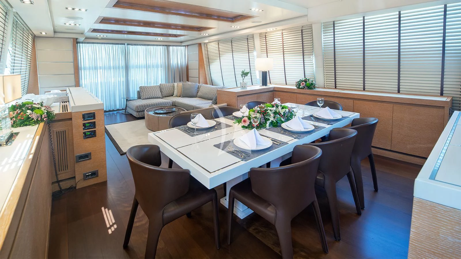 a large room with a table and chairs aboard ELEVEN I Yacht for Sale
