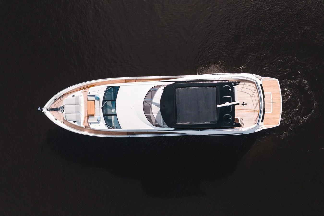 a white car with a black stripe aboard 88 YACHT Yacht for Sale