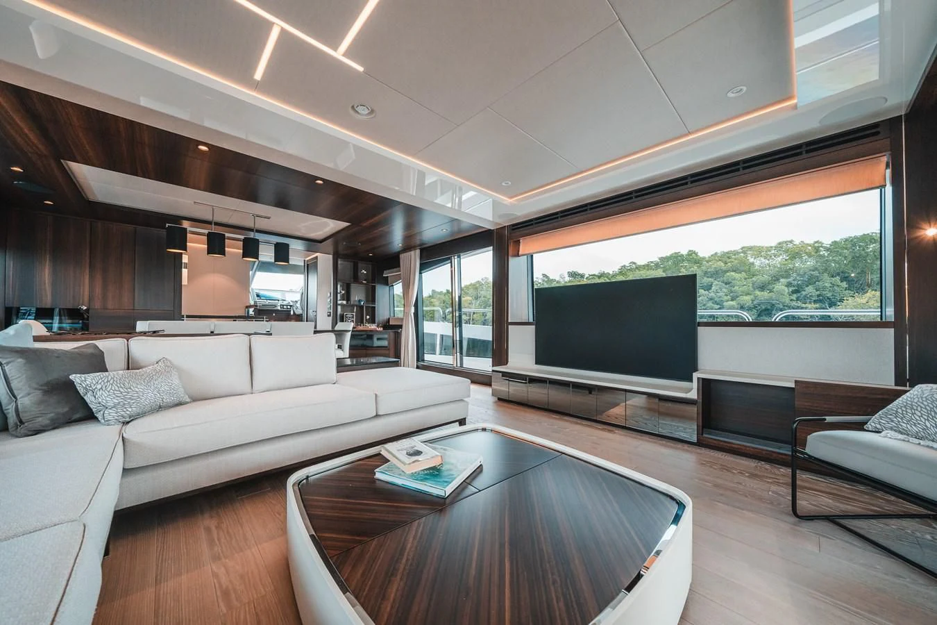 a living room with a large screen aboard 88 YACHT Yacht for Sale