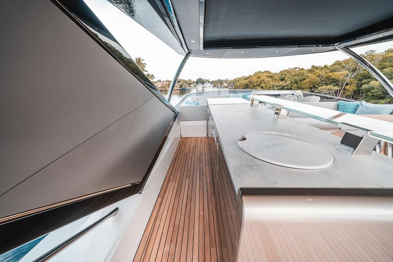 a wood deck with a white plate and a white plate on it aboard 88 YACHT Yacht for Sale